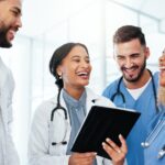 Doctor,,Nurse,And,Team,Work,On,Tablet,For,Healthcare,Research,